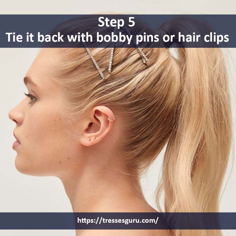 Tie it back with bobby pins or hair clips