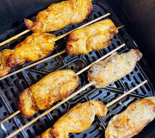 Air Fryer Chicken Skewers doused in garlic parmesan and bang bang sauce